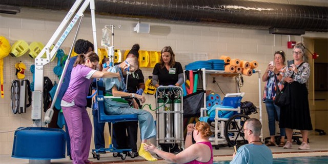 Thomas Roberts, who was a patient on the Palliative Care and Comfort Unit at UAB, was baptized surrounded by his wife, son, two sisters, niece and nephew and his UAB care team. (handout/ The University of Alabama at Birmingham)