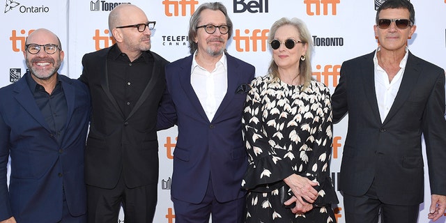 Scott Z. Burns, left, Steven Soderbergh, Gary Oldman, Meryl Streep, and Antonio Banderas attend "The Laundromat" premiere during the 2019 Toronto International Film Festival.