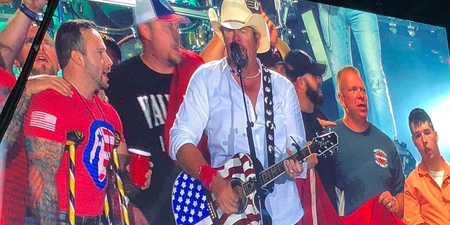 Toby Keith helped The Independence Fund present veteran Brandon Rumbaugh with an all-terrain wheelchair on Saturday.