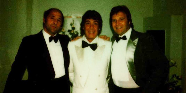 Tommaso Buscetta posing with two gangsters on his wedding day in prison.