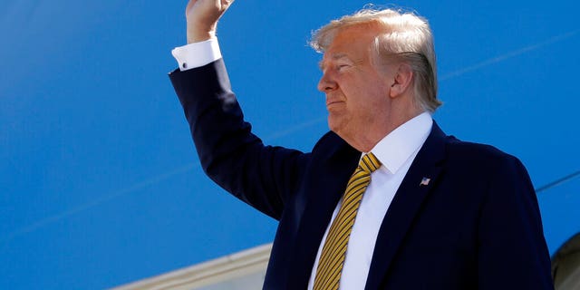 FILE- In this Sept. 17, 2019, file photo, President Donald Trump boards Air Force One at Albuquerque International Sunport in Albuquerque, N.M. A new poll by The Associated Press-NORC Center for Public Affairs Research finds about half of Americans think Donald Trump's actions as president have made things worse for African Americans, Muslims and women. (AP Photo/Evan Vucci, File)