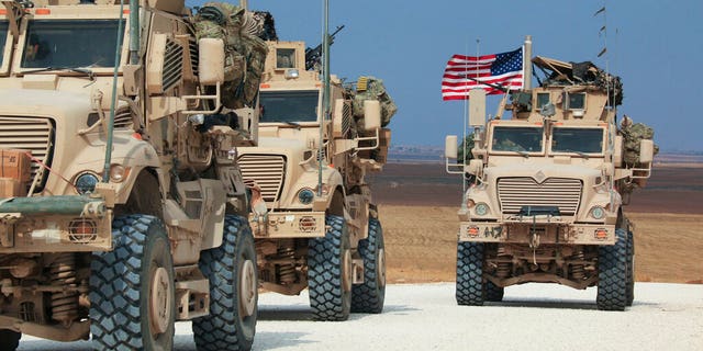 American military convoy stops near the town of Tel Tamr, north Syria, Sunday, Oct. 20, 2019. (AP Photo/Baderkhan Ahmad)