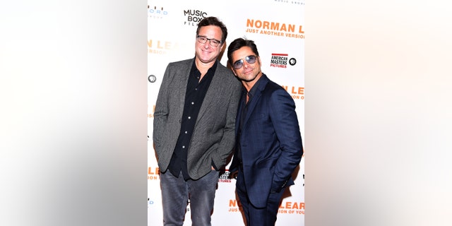 Actors Bob Saget and John Stamos attend the Los Angeles Premiere of