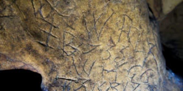 The cave is thought to be the largest collection of "witches' marks" in the U.K.  (Creswell Crags Museum and Heritage Centre)
