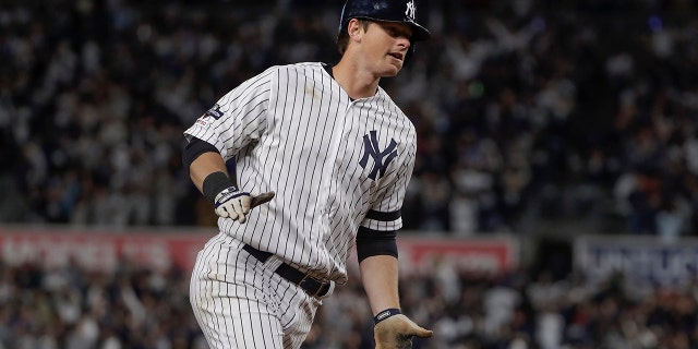 New York Yankees' DJ LeMahieu rounds the bases after hitting a solo home run against the Minnesota Twins during the sixth inning of Game 1 of an American League Division Series baseball game, Friday, Oct. 4, 2019, in New York. (Associated Press)