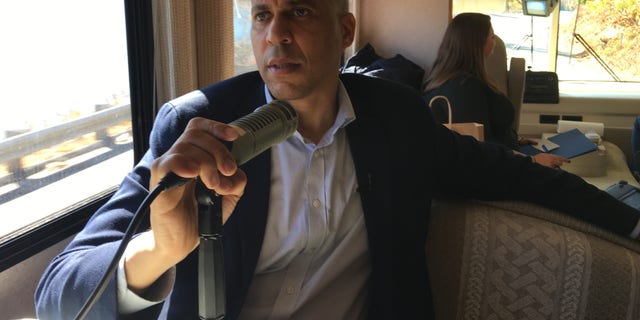 Democratic presidential candidate Sen. Cory Booker of New Jersey speaking with Fox News and NHTalkRadio.com aboard his campaign RV on the road from Peterborough to Keene, N.H., on Monday.