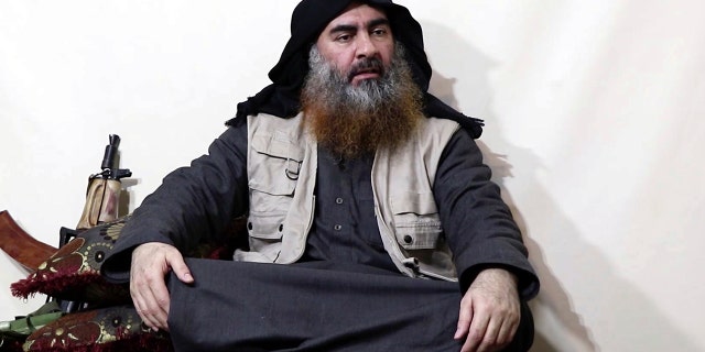 This file image made from a video posted on a militant website in April 2019 purportedly shows former ISIS leader Abu Bakr al-Baghdadi.