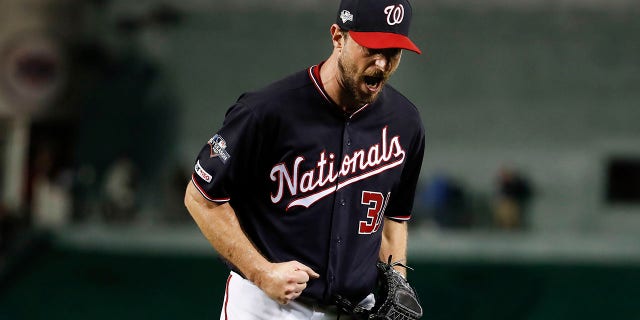 Washington Nationals starting pitcher Max Scherzer (31) reacts after striking out Los Angeles Dodgers left fielder Chris Taylor (3) in the seventh inning in Game 4 of a baseball National League Division Series, Monday, Oct. 7, 2019, in Washington. (AP Photo/Alex Brandon)