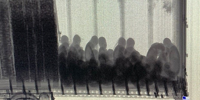 The group was discovered inside the trailer by using X-Rays, which showed dozens locked inside.