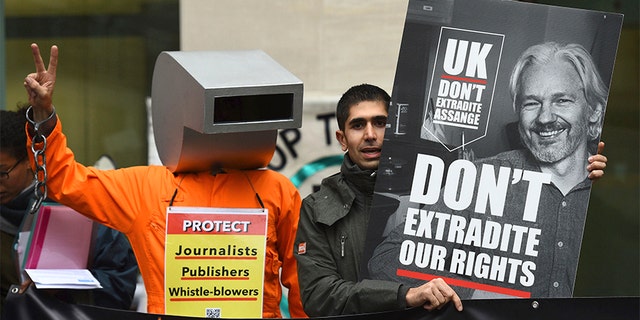 Supporters of Wikileaks founder Julian Assange demonstrate outside Westminster Magistrates' Court in London. (AP)