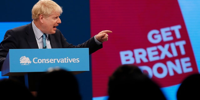 Britain's Prime Minister Boris Johnson delivers his Leader's speech at the Conservative Party Conference in Manchester, England, on Wednesday. (AP)