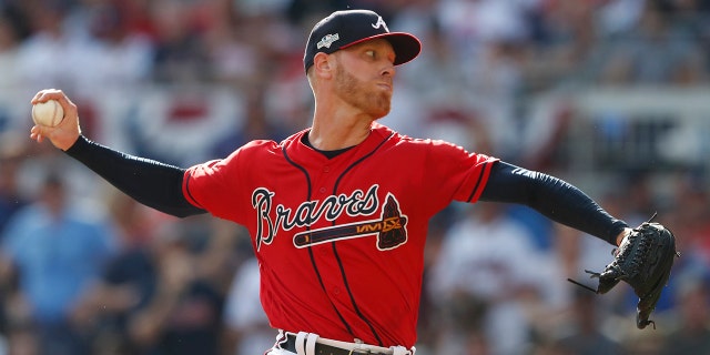 Atlanta Braves starting pitcher Mike Foltynewicz (26) works in the first inning during Game 2 of a best-of-five National League Division Series against the St. Louis Cardinals, Friday, Oct. 4, 2019, in Atlanta. (AP Photo/John Bazemore)
