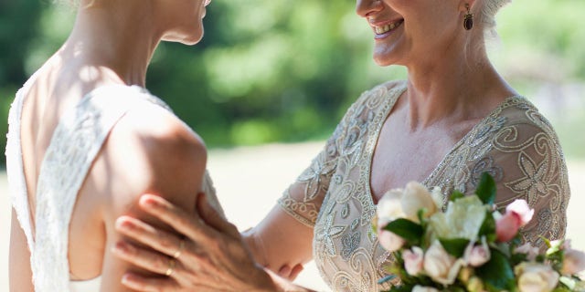 Writing that the “beautiful” ceremony and reception were “so much fun,” the bride revealed that she was called out by her mother-in-law after the big event – as the groom’s mom didn’t know that the couple had legally married months before.