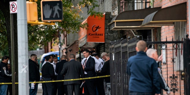 Authorities responded to a call about shots fired just before 7 a.m. and found four men dead in the Crown Heights neighborhood of Brooklyn at an address that corresponds to a private social club according to an online map of the street. A woman and two men suffered non-life-threatening injuries. (AP Photo/Jeenah Moon)