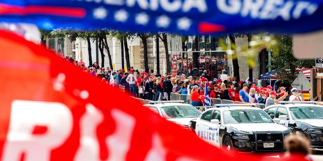 The line to enter the campaign rally for President Trump forming outside the American Airlines Center on Thursday in Dallas. (AP Photo/Jeffrey McWhorter)