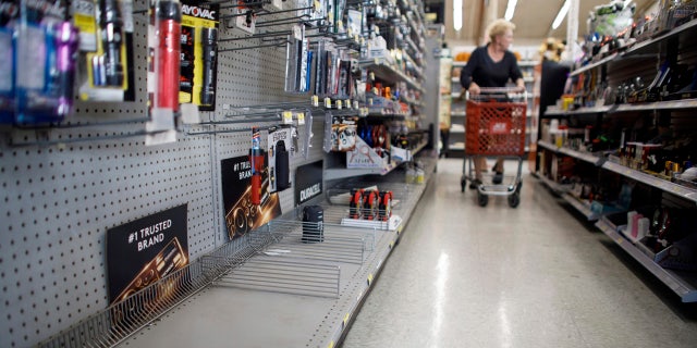 The lantern section is nearly empty at an ACE Hardware store as shoppers prepare for possible power shutoffs in Los Gatos, Calif., Tuesday, Oct. 8, 2019.