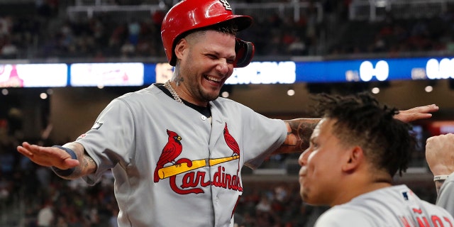 St. Louis Cardinals catcher Yadier Molina celebrates in the ninth inning during Game 1 of a best-of-five National League Division Series agaimnst the Atlanta Braves, Thursday, Oct. 3, 2019, in Atlanta. (AP Photo/John Bazemore)