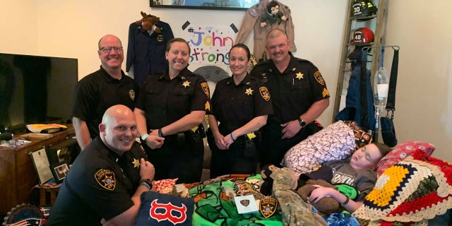 Clinton County Sheriffs visit John at home.