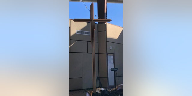 While Northway Church had its roof torn off and much of the building was destroyed after Sunday's F-3 tornado, a wooden cross stood, seen as a symbol of hope for the community.