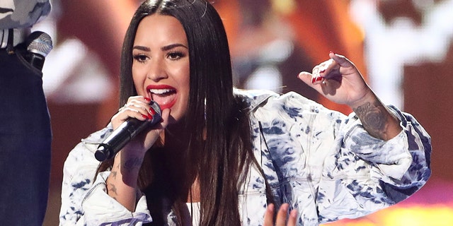 Demi Lovato is tapped to sing the national anthem. (Photo by John Salangsang/Invision/AP, File)