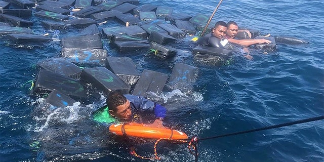 Three suspected drug smugglers floated for hours after their boat sank. The trio used cocaine bails as flotation devices, according to authorities.