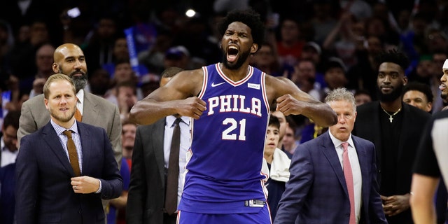 Philadelphia 76ers' Joel Embiid reacts after it was announced that he and Minnesota Timberwolves' Karl-Anthony Towns were ejected, during the second half of an NBA basketball game Wednesday, Oct. 30, 2019, in Philadelphia. The 76ers won 117-95.