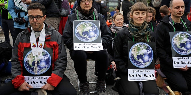 Climate protestors block Lambeth bridge leading to Britain's Parliament in central London on Monday. (AP)