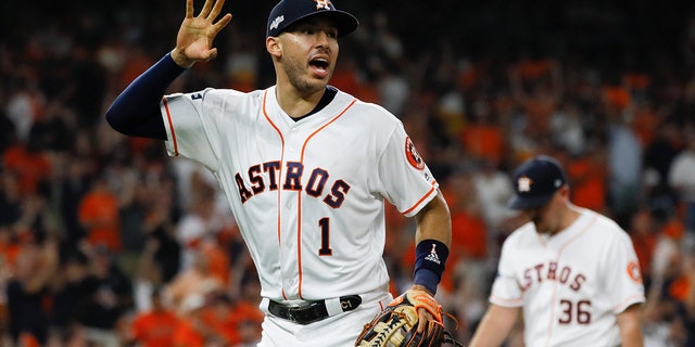 Houston Astros shortstop Carlos Correa celebrates after the end of the top of the sixth inning in Game 6 of baseball's American League Championship Series against the New York Yankees, Oct. 19, 2019, in Houston. (Associated Press)