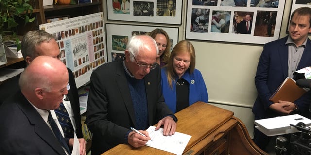 Democratic presidential candidate Sen. Bernie Sanders of Vermont signs the necessary paperwork to file to place his name on New Hampshire's first-in-the-nation presidential primary ballot. At the Statehouse in Concord, N.H., on Oct. 31, 2019