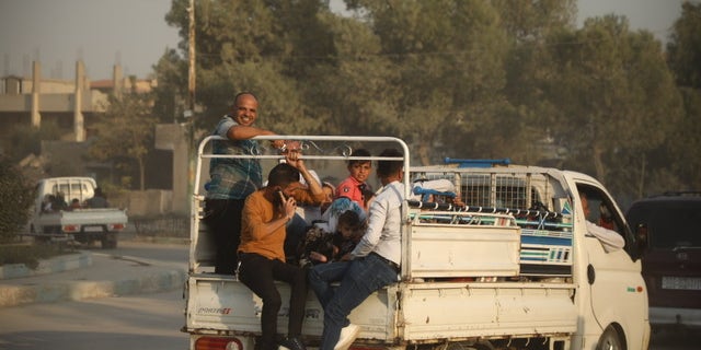 Kurdish Syrians fleeing Wednesday afternoon