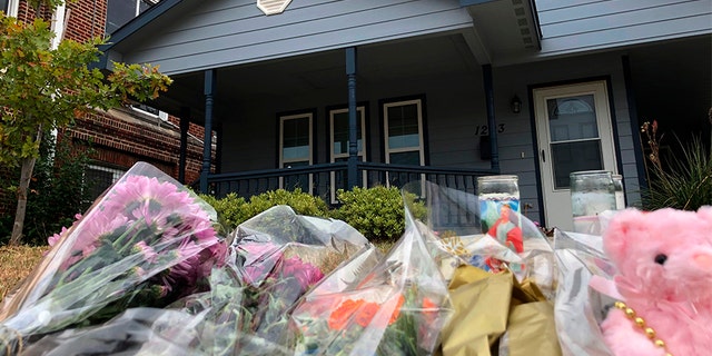 Bouquets of flowers and stuffed animals piling up outside the Fort Worth home on Monday, where a 28-year-old black woman was shot and killed by a white police officer.