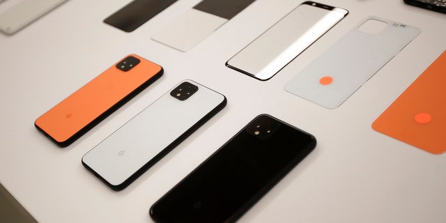 In this Tuesday, Sept. 24, 2019, photo New Pixel 4 phones are displayed at Google in Mountain View, Calif. (AP Photo/Jeff Chiu)