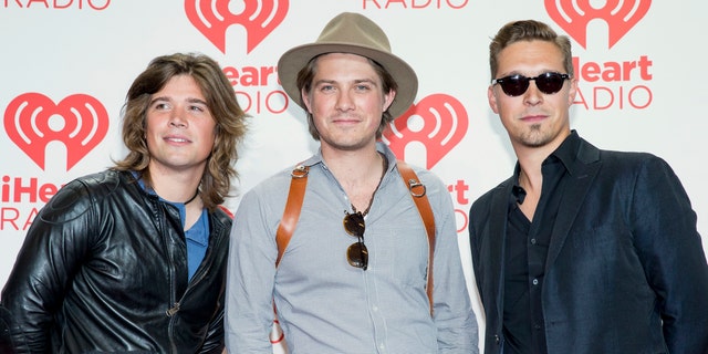 From left, Zac, Taylor, and Isaac Hanson, arrive at the iHeartRadio Music Festival at the MGM Grand Garden Arena in Las Vegas.