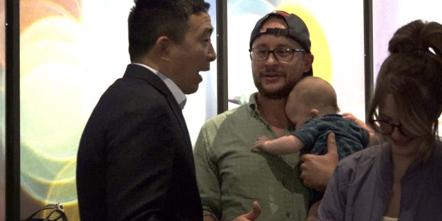 New Hampshire voter Anthony Hegstrom meets Andrew Yang. Hegstrom said he'll vote for Trump again if Yang doesn't get the Democratic nomination.