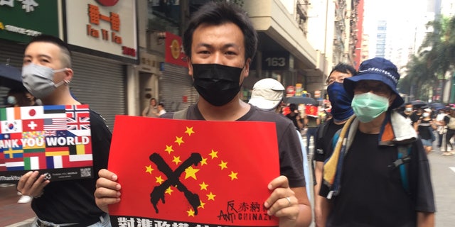 Tuesday’s protest, coinciding with China’s National Day, was described by officials as the worst for Hong Kong. Activists hurled gas bombs and rocks. Police responded with water cannons, rubber bullets and, in one case, a real one that injured a protester. 