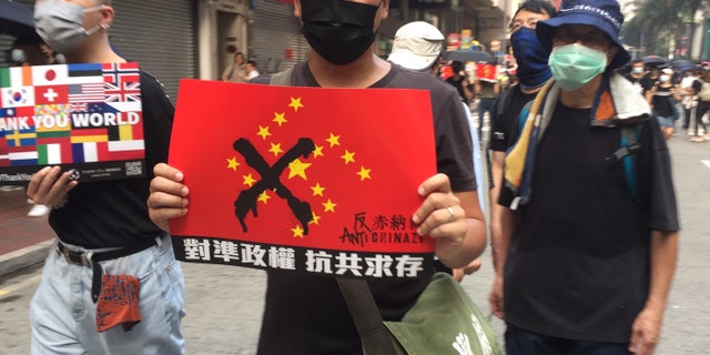 Tuesday’s protest, coinciding with China’s National Day, was described by officials as the worst for Hong Kong. Activists hurled gas bombs and rocks. Police responded with water cannons, rubber bullets and, in one case, a real one that injured a protester. 