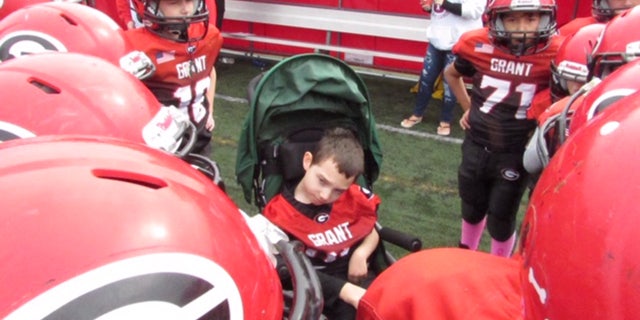 The Grant Jr. Bulldogs youth football team in Fox Lake, Ill., made Bryson Jenkins, who has cerebral palsy, the honorary captain on October 5 and now he is officially considered part of the team, Brittany Jenkins, Bryson’s mother, said.