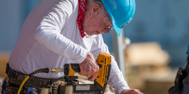 Carter has taken part in 36 building projects with the organization. (Robert Franklin/South Bend Tribune via AP) File
