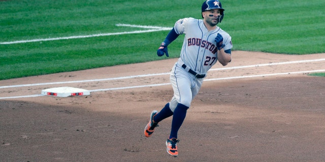 Jose Altuve rounds the bases after his first-inning home run at Yankee Stadium. (AP Photo/Seth Wenig)