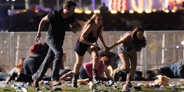 People run from the Route 91 Harvest country music festival after apparent gun fire was hear on October 1, 2017 in Las Vegas, Nevada.