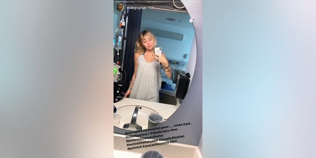 Miley Cyrus says she "redesigned my hospital gown."