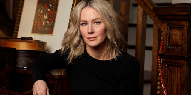 In this Oct. 8, 2019, photo, singer-songwriter Allison Moorer poses in Nashville, Tenn. to promote her memoir,
