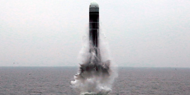 An image provided by a North Korean news agency shows an underwater-launched ballistic missile. Officials said the missile traveled twice as high as the orbit of the international space station. (Korean Central News Agency/Korea News Service via AP)