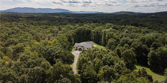 The pictures of the $2.79 million, four-bedroom, five-bathroom home in leafy Wappingers Falls, New York, starts like any other listing online.