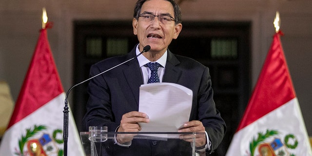Peru's President Martin Vizcarra delivers a national message from the government palace in Lima, Peru, on Monday.