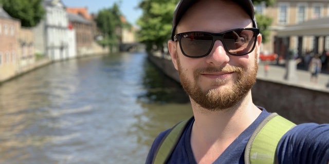 Doron Berlin, 31, was on holiday in Belgium when he looking up to see swirling clouds of blue and grey set against the brilliant sun and spires near Bruges' Belfry bell tower.