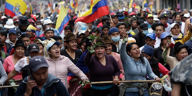 Indigenous antigovernment demonstrators chant slogans against President Lenin Moreno and his economic policies during a nationwide strike in Quito on Wednesday. (AP)