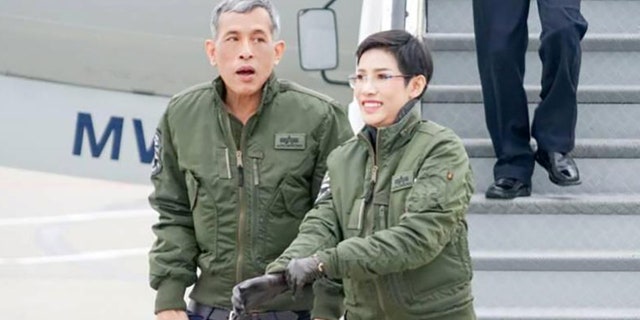 This undated photo posted Monday, Aug. 26, 2019, on the Thailand Royal Office website shows King Maha Vajiralongkorn with Major General Sineenatra Wongvajirabhakdi, the royal noble consort. (Thailand Royal Office via AP)