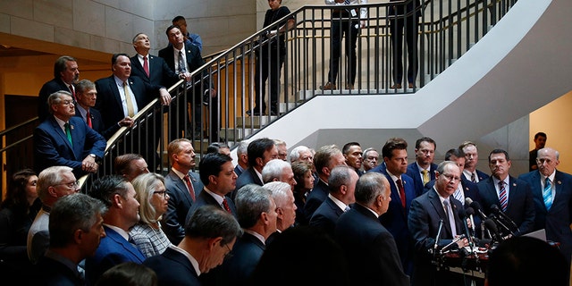 House Republicans hold a news conference before heading into a closed-door meeting where Deputy Assistant Secretary of Defense Laura Cooper was set to testify as part of the House impeachment inquiry into President Trump, on Oct. 23, 2019. (AP Photo/Patrick Semansky)