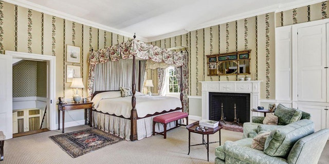 The spacious master suite features a sitting area and fireplace.